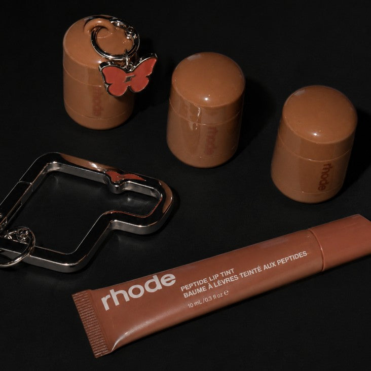 pocket pearls, flutter charm, rhode carabiner, peptide lip tint sweet apple