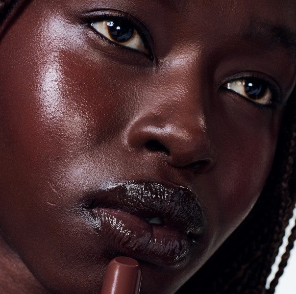 nyawuta wears peptide lip tint espresso